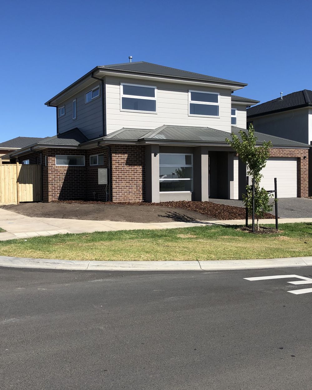 Sandy Road build in progress, completed home at handover, jan 2019