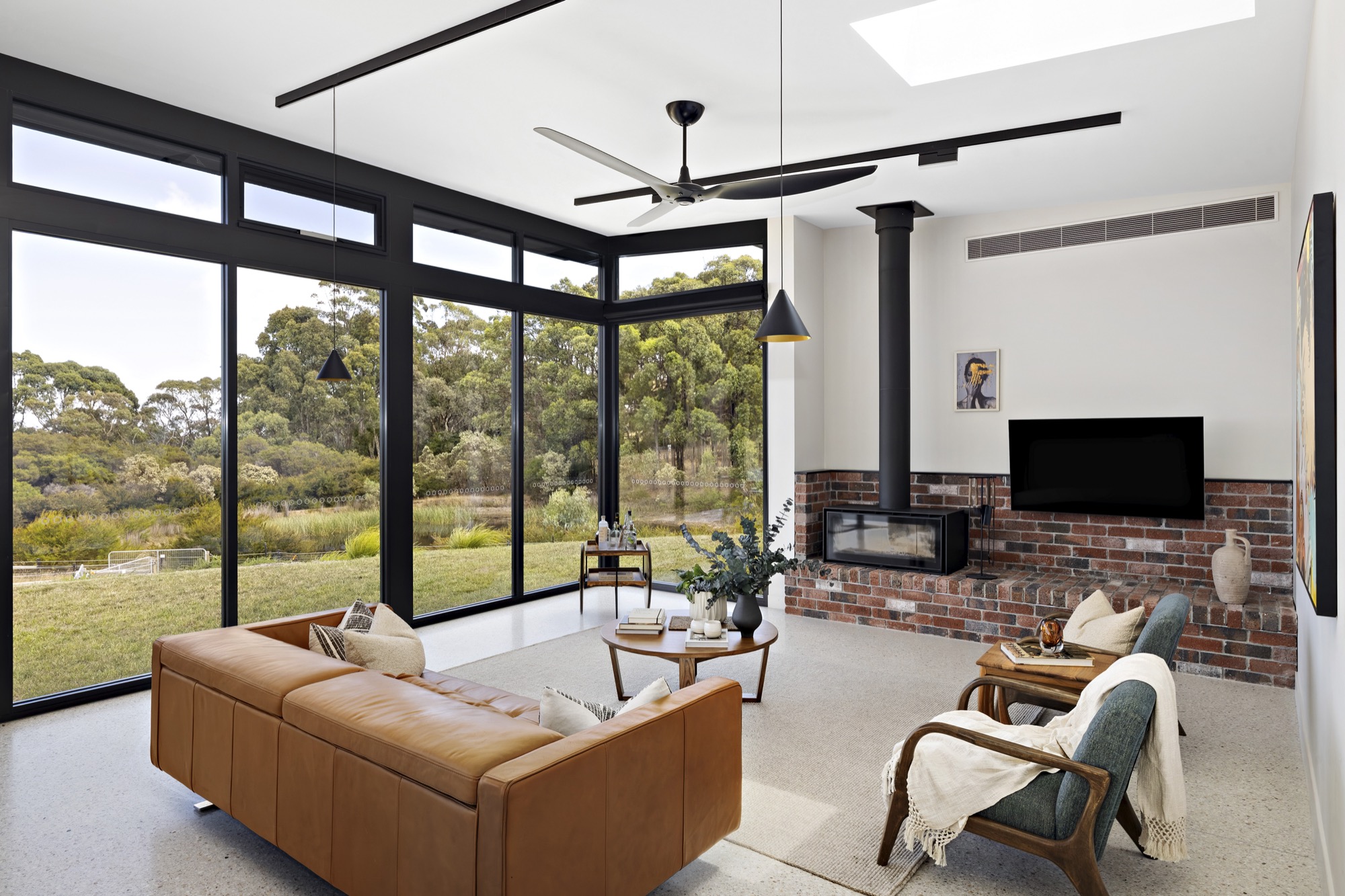 Styled open-plan living at Waterfall Gully Road with bay views